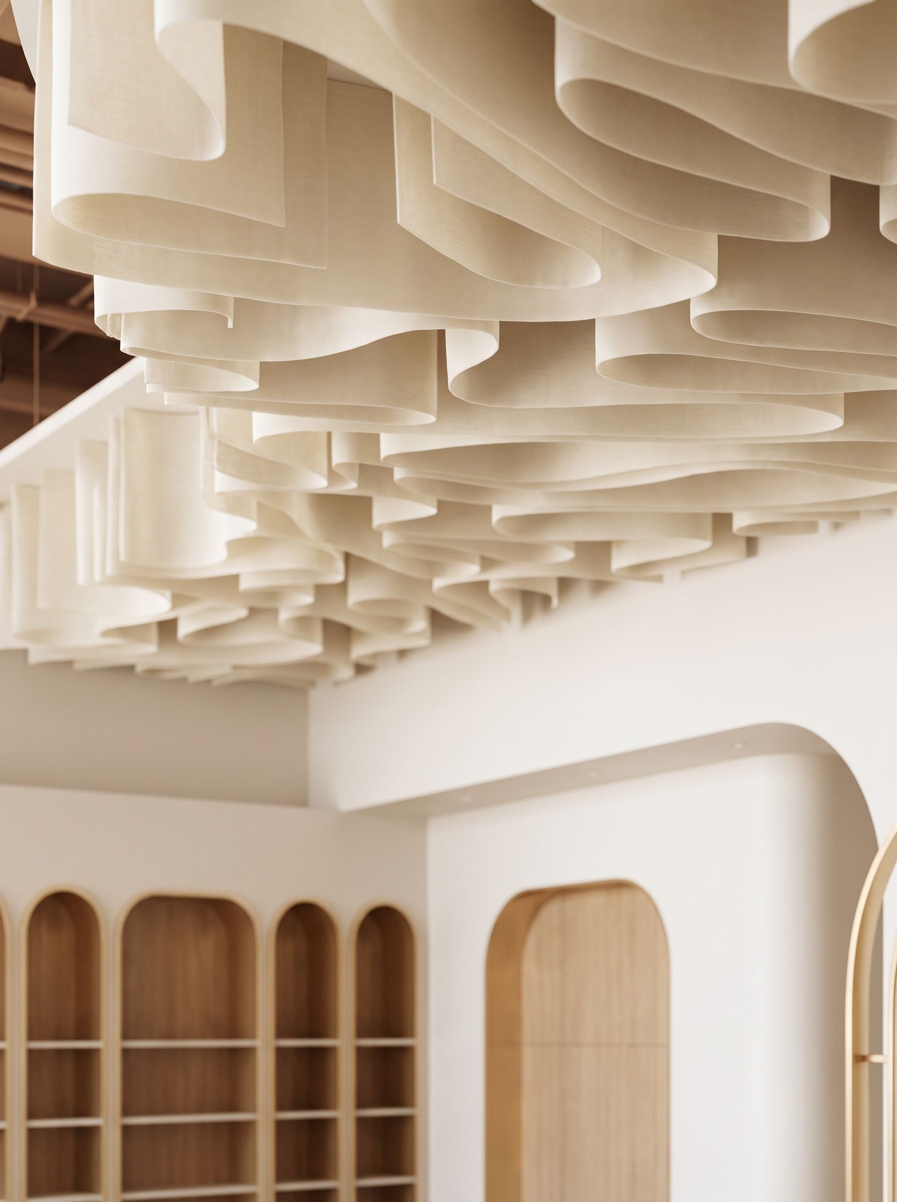 The sculptural ceiling above the Glowin retail wall